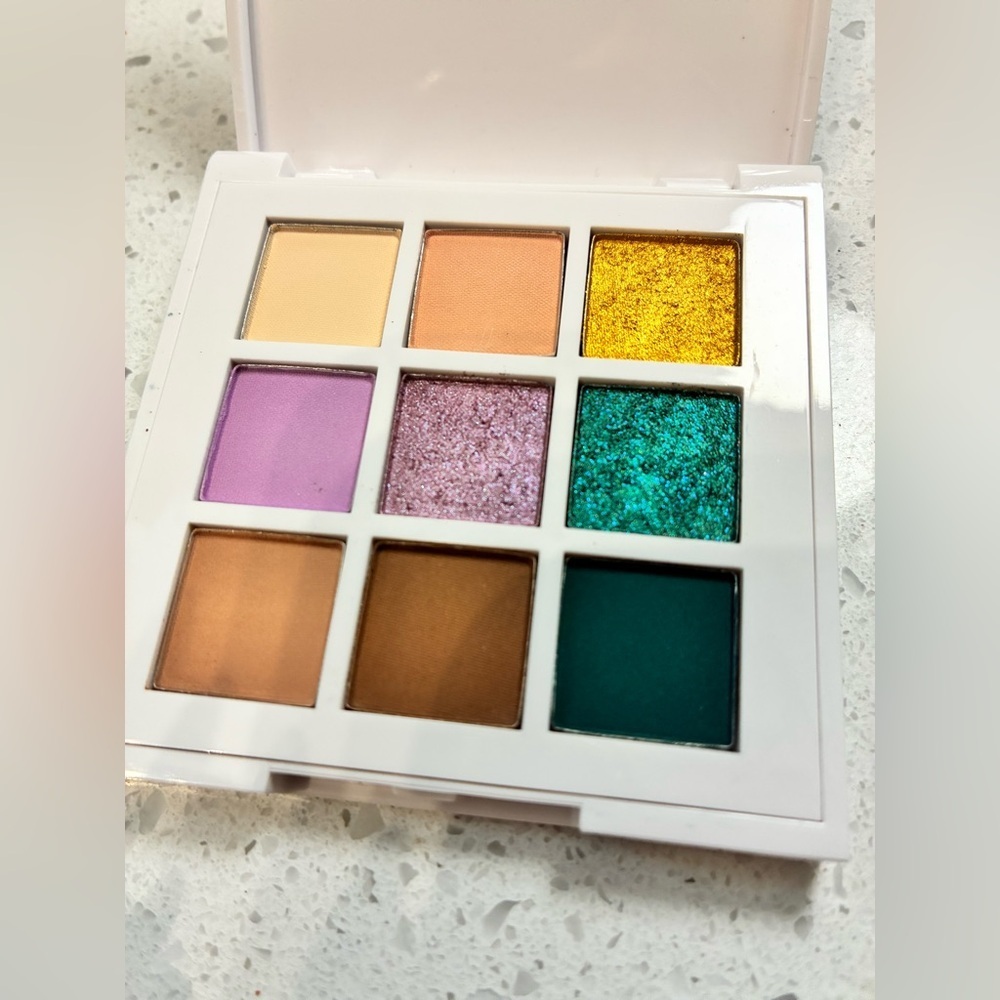 Just Ximena You & Me in Miami Eyeshadow Palette with Gold, Purple, and Teal Hues